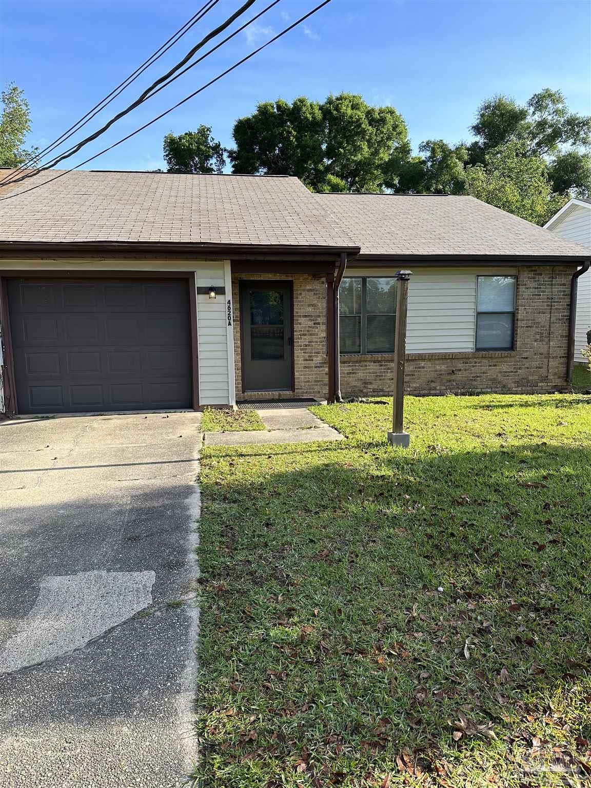 a house with yard in front of it