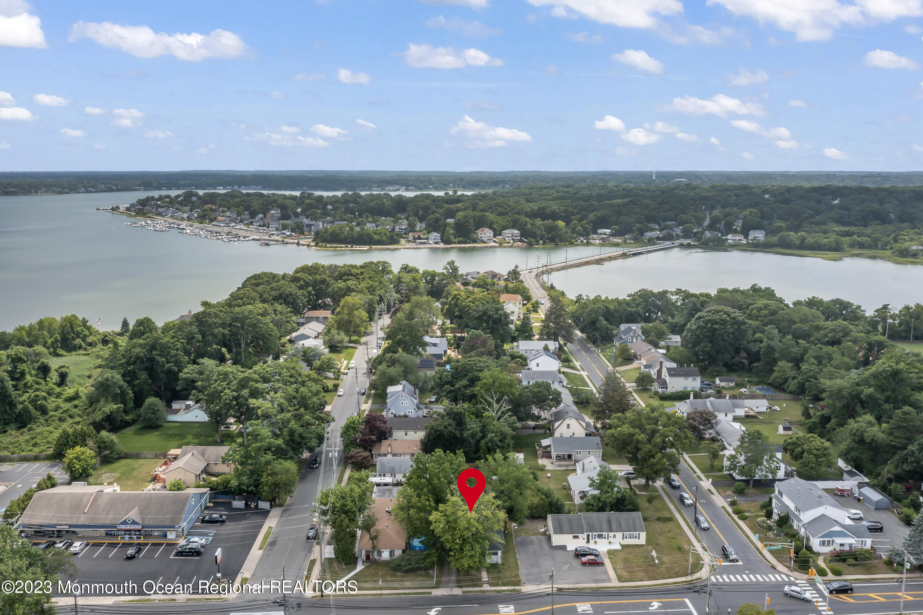 an aerial view of residential building and lake