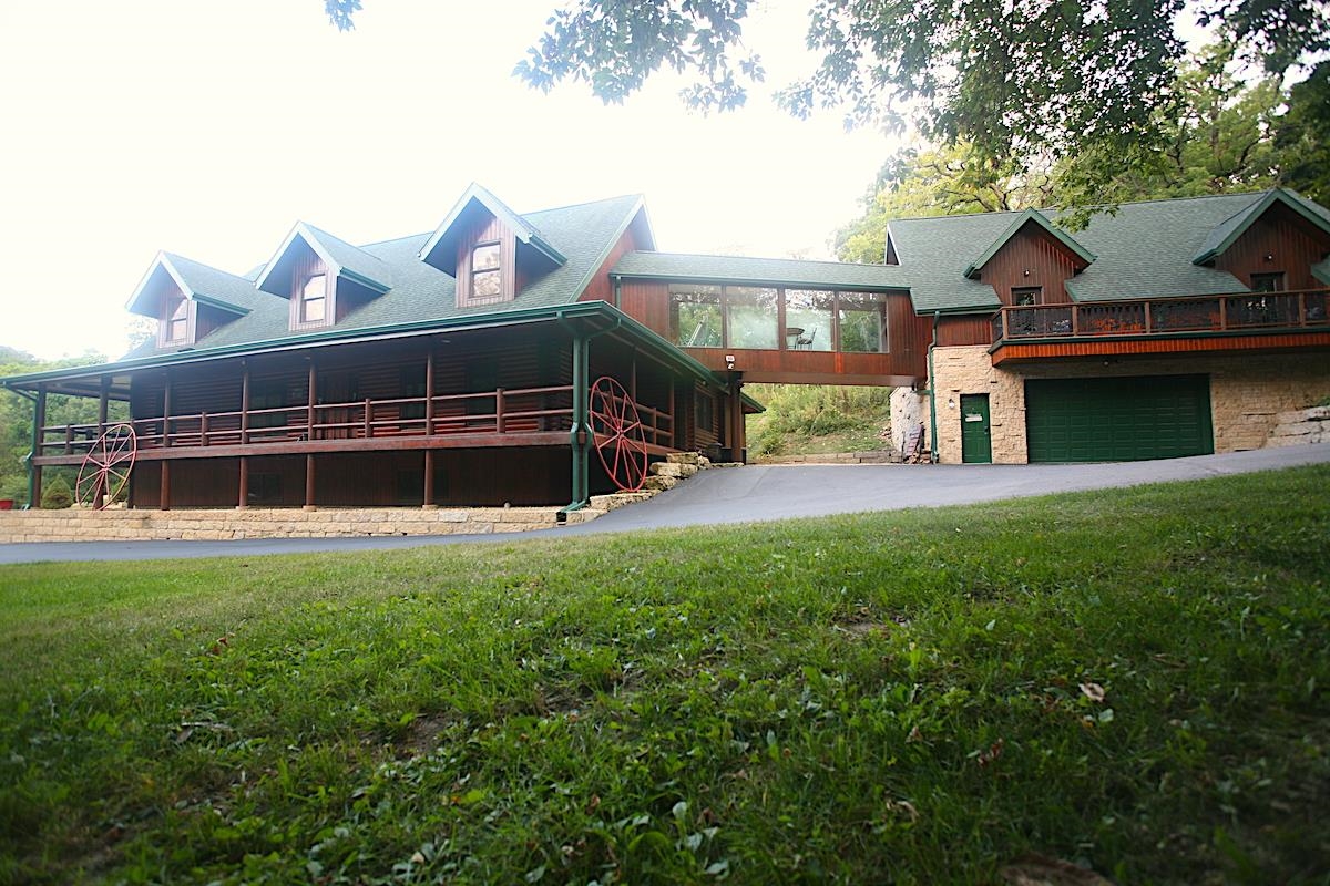 a view of house with yard and entertaining space