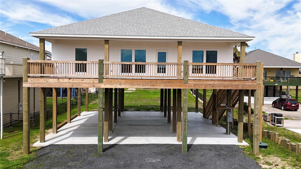 a view of a house with wooden deck