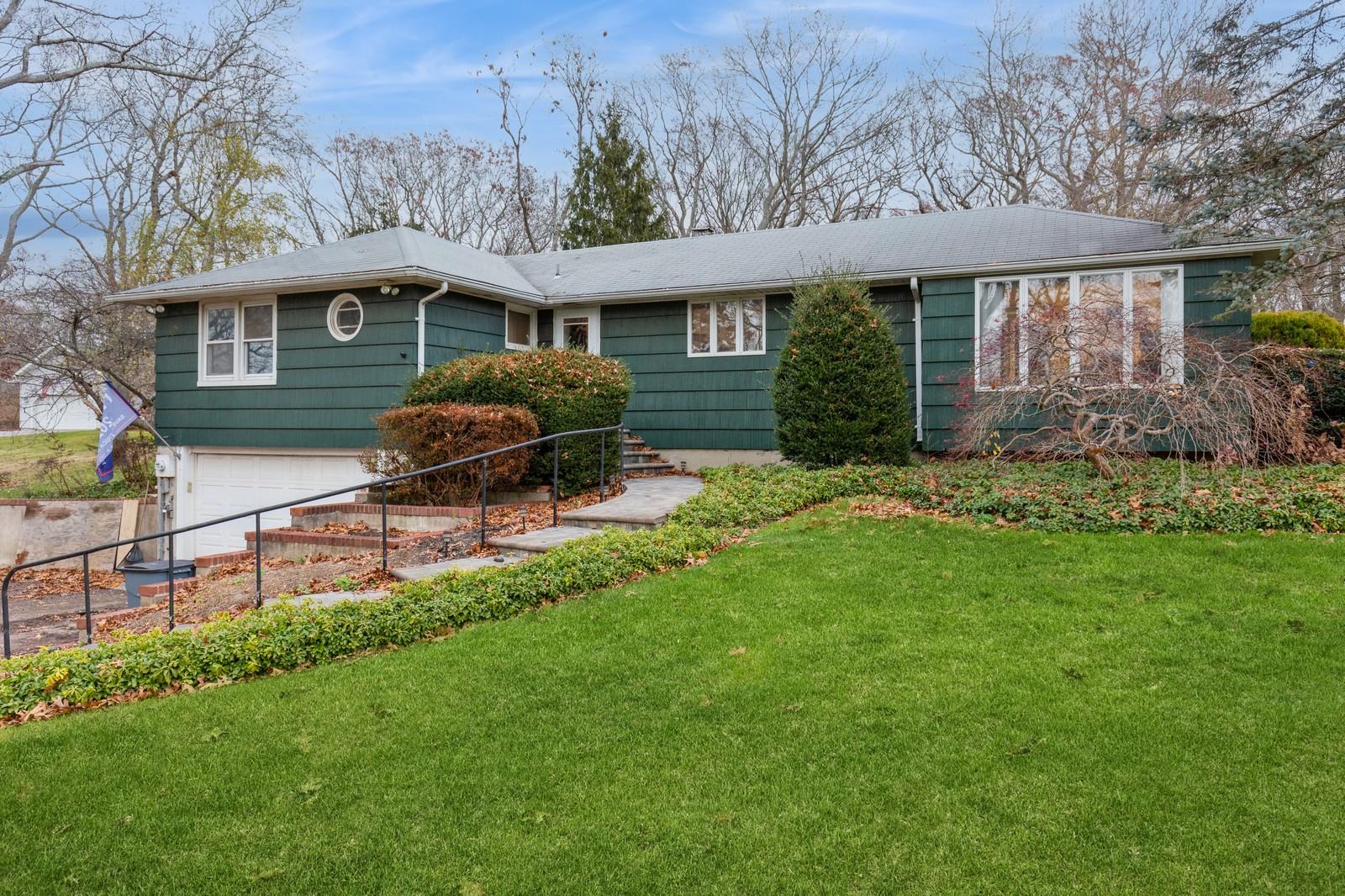 front view of a house with a yard