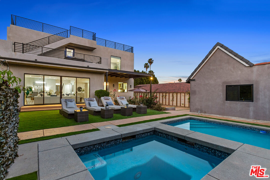 a front view of house with yard and outdoor seating