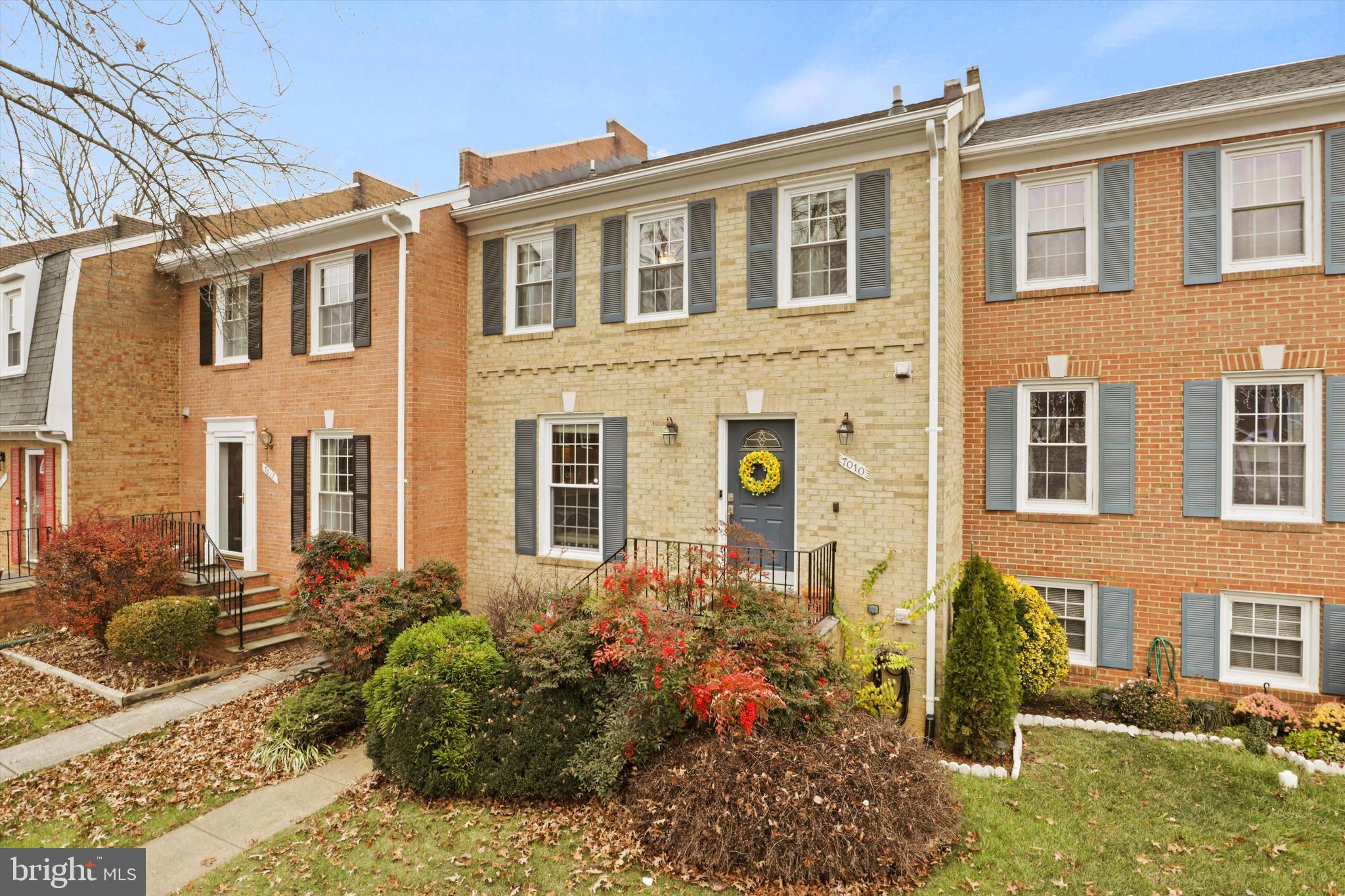 front view of a brick house with a large windows