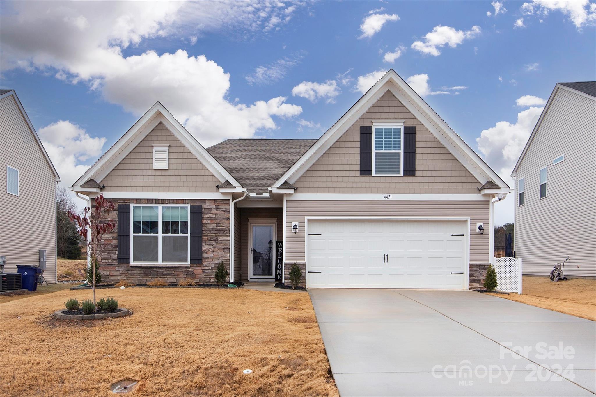 a front view of a house with a garage