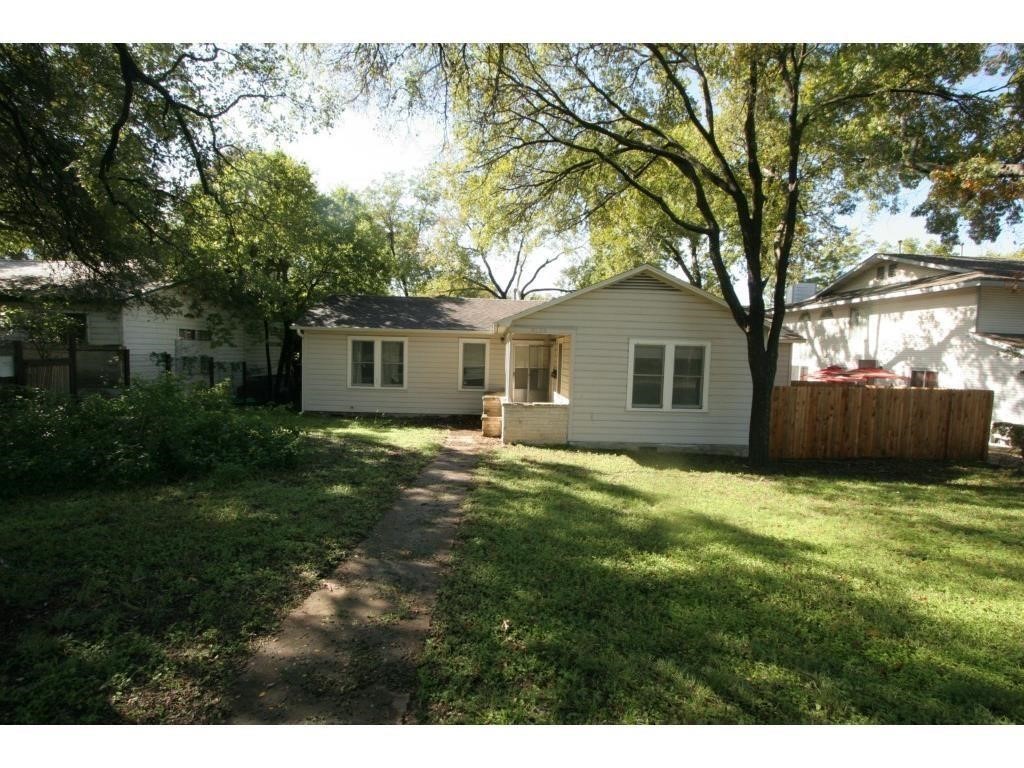 a house with a tree in front of it