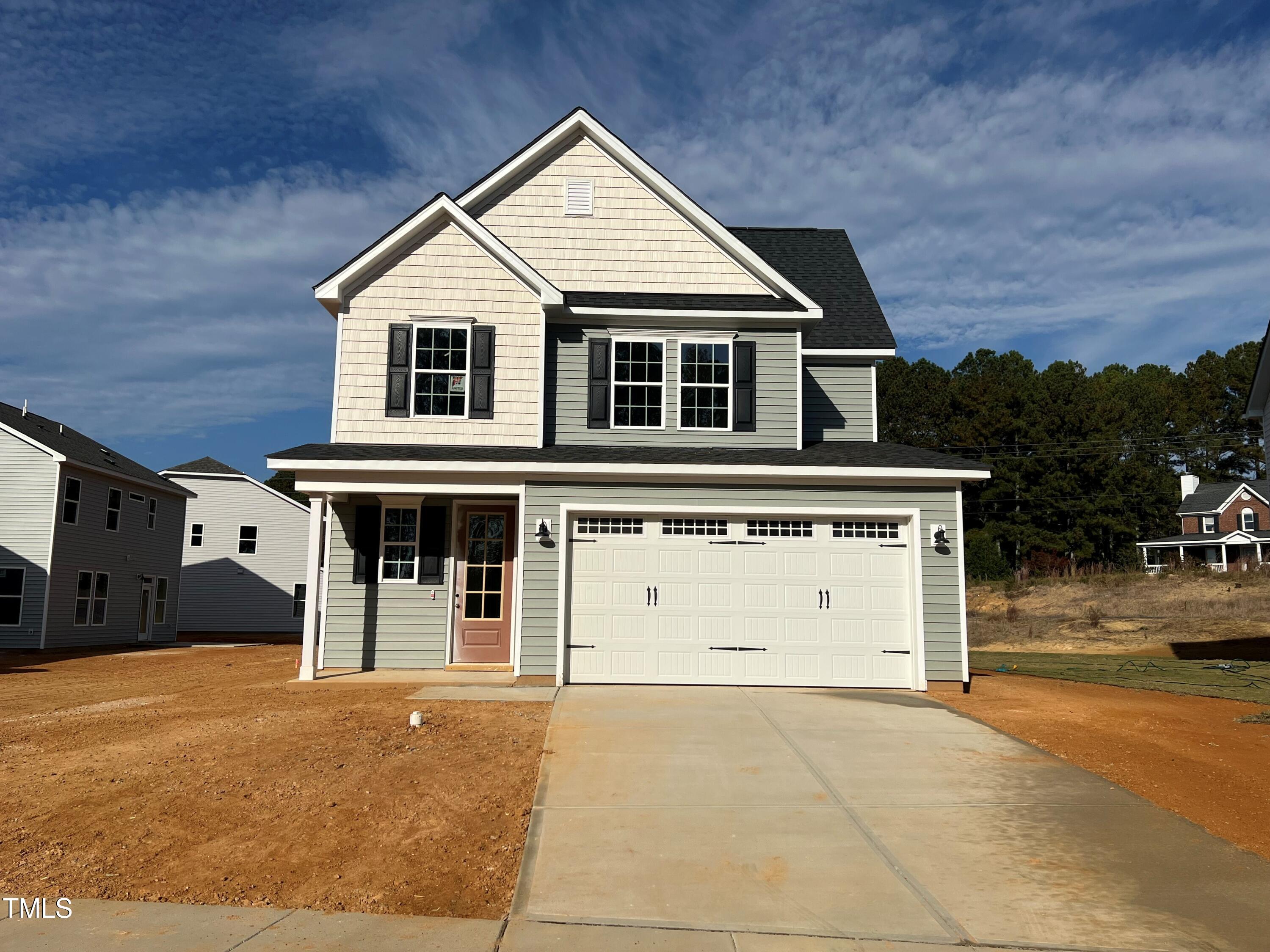 a view of a house with a parking space