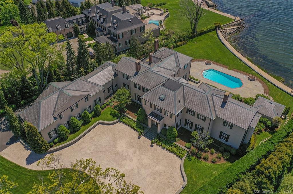 an aerial view of multiple houses with yard