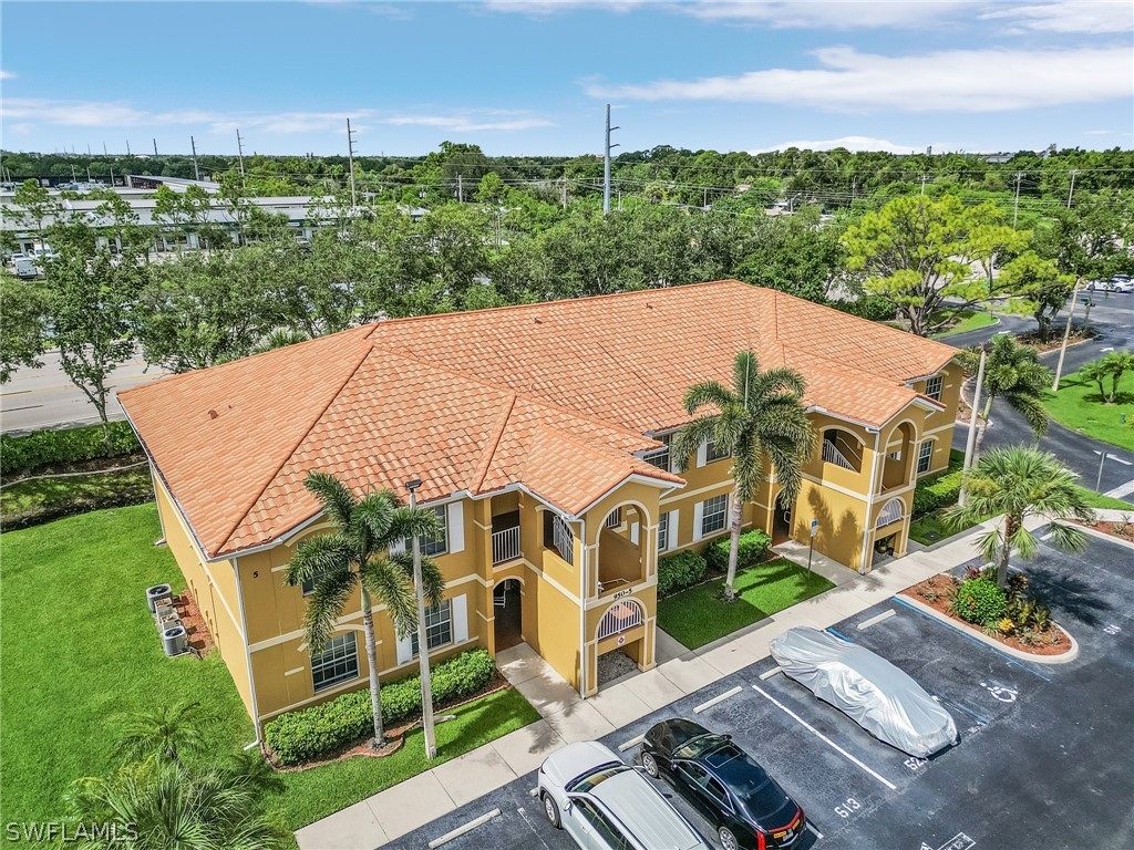 an aerial view of a house with a yard