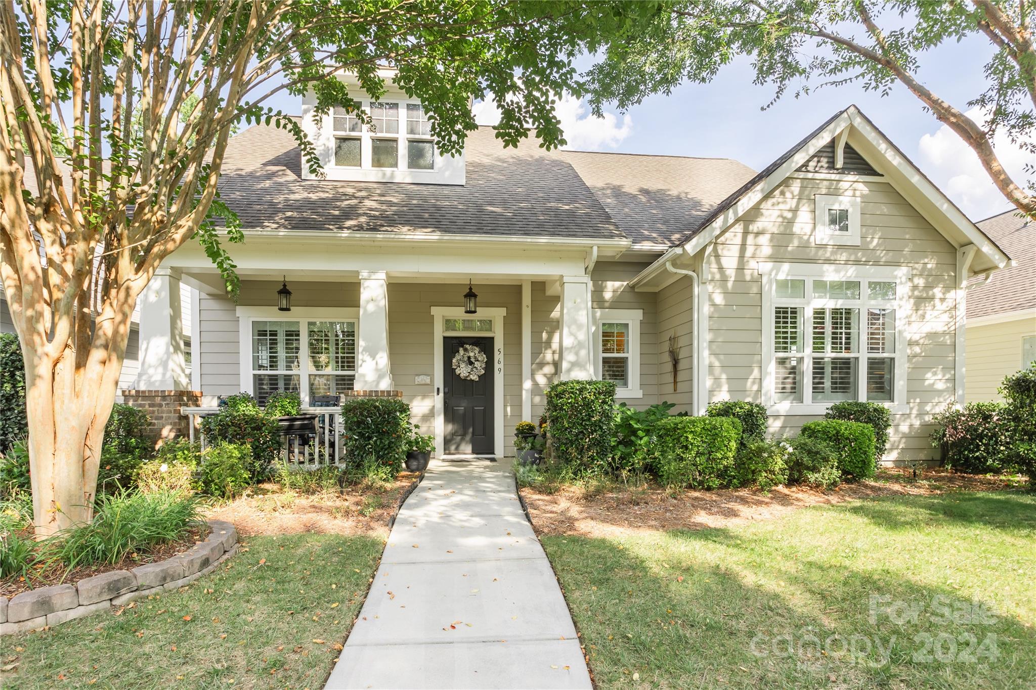 front view of a house with a yard