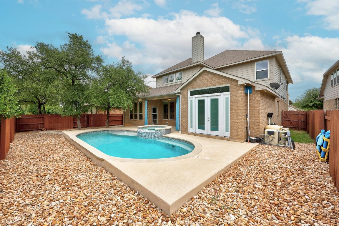 a front view of a house with a garden and patio