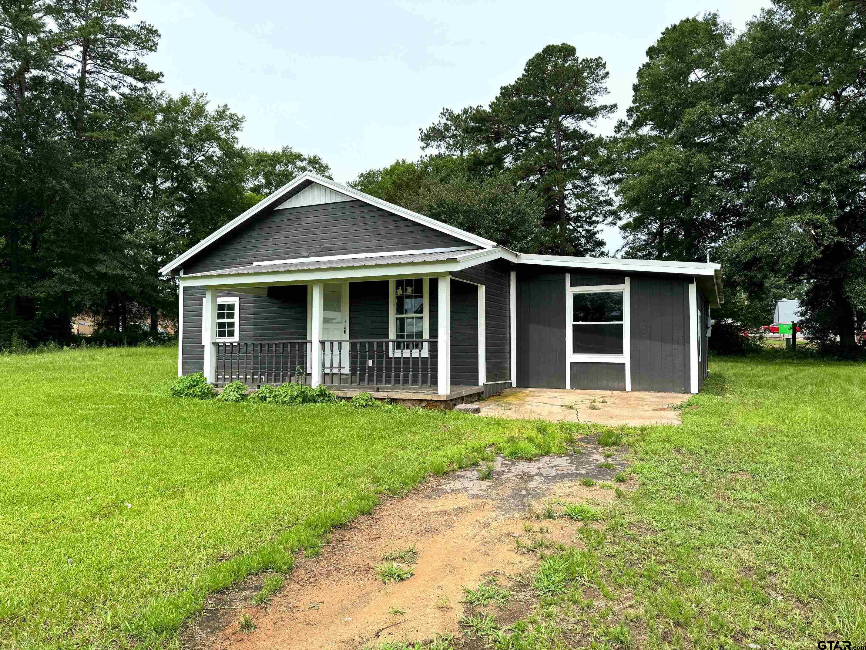 front view of a house with a yard