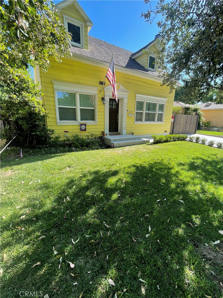 a view of a house with a back yard