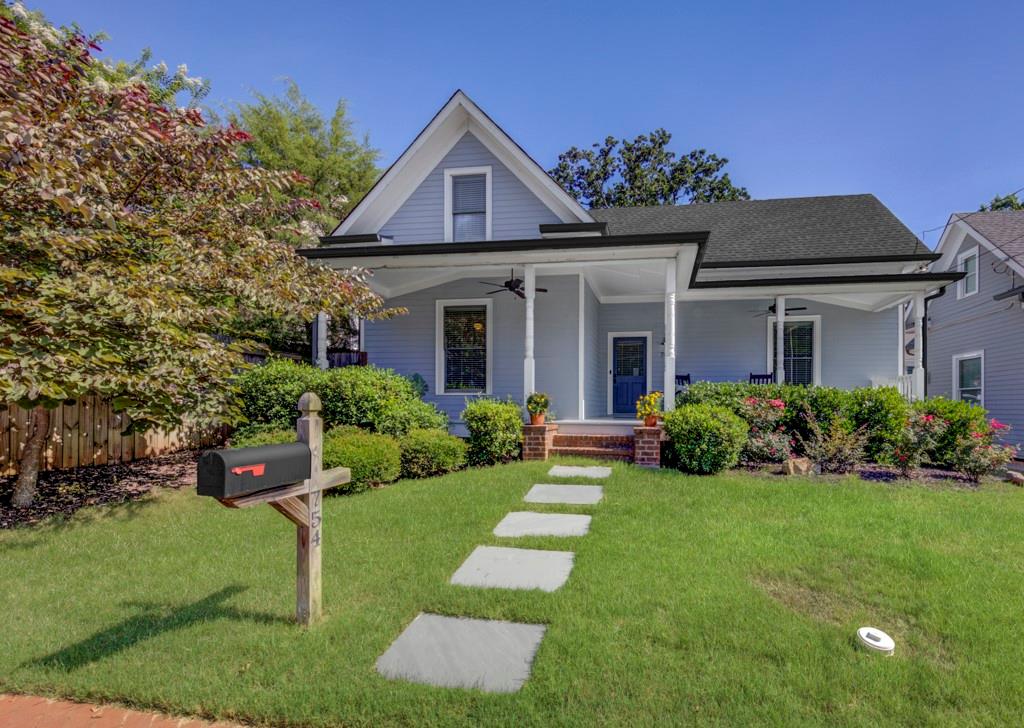 a front view of a house with a yard