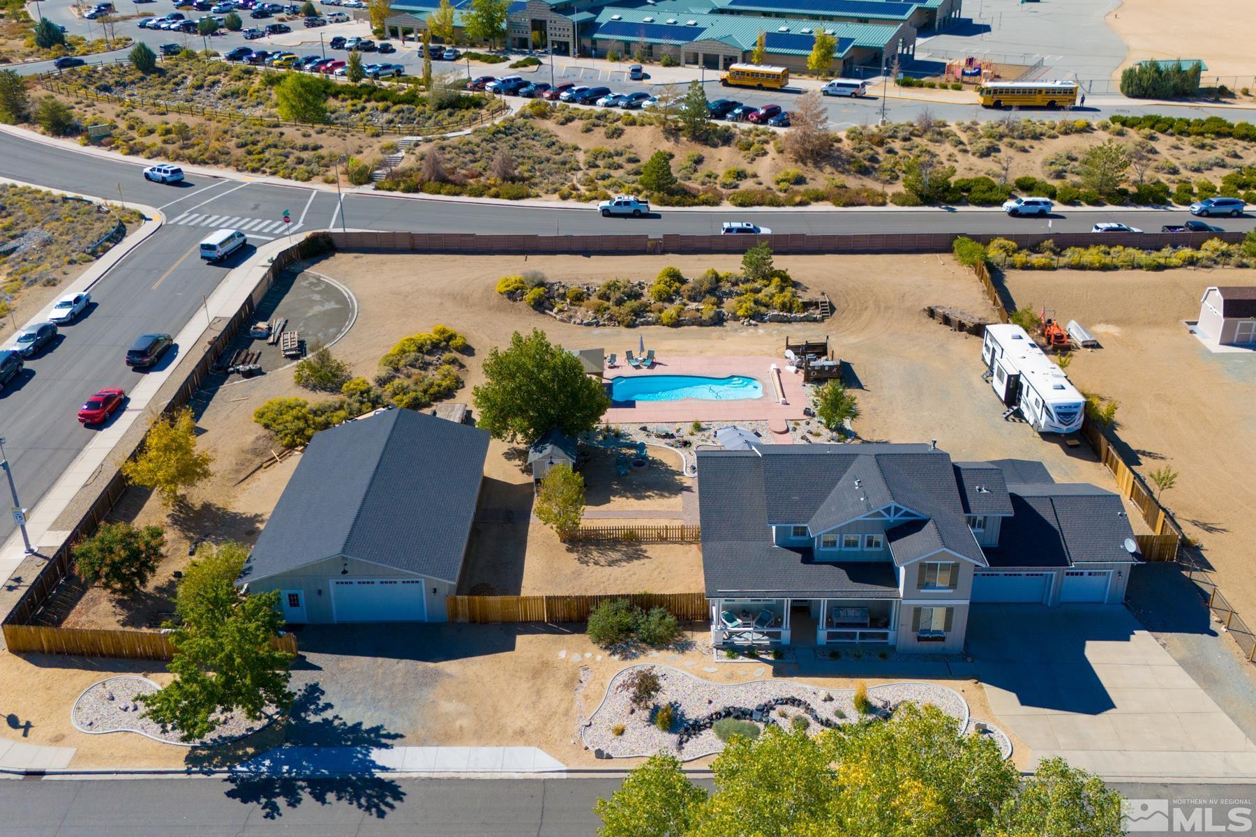 an aerial view of a house with a lake view