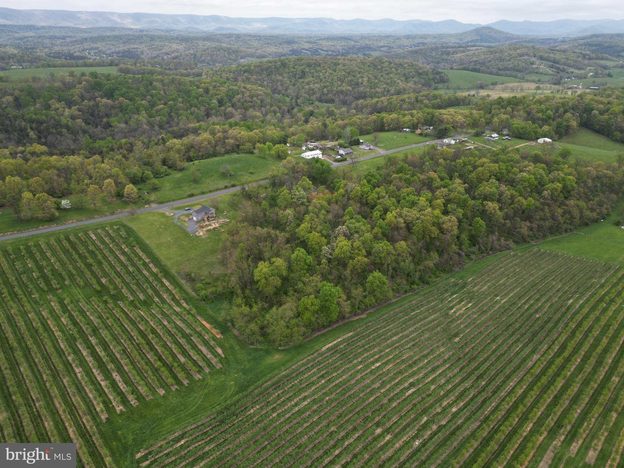 a view of a green field with an outdoor space