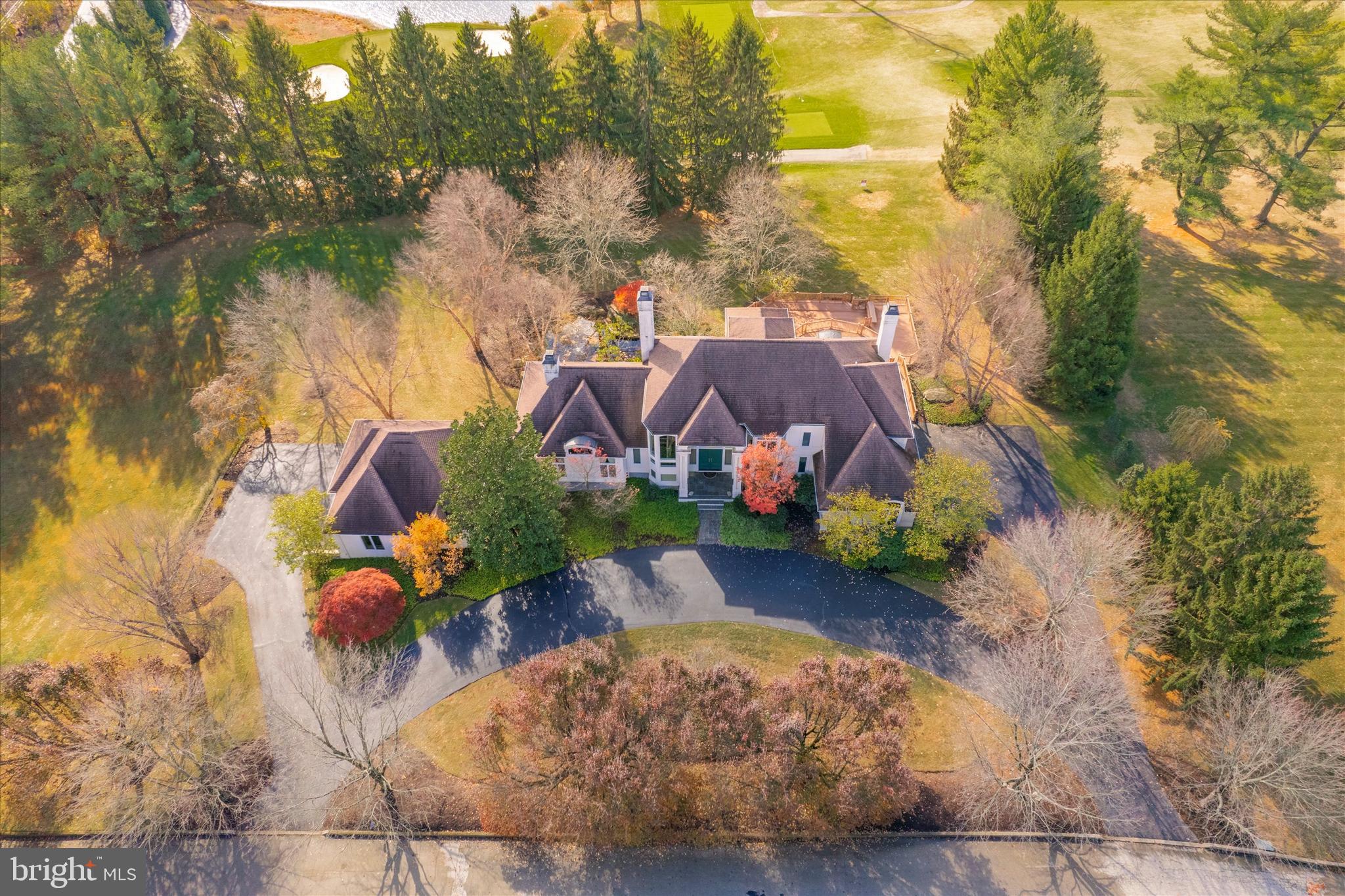 a front view of a house with a yard and garden