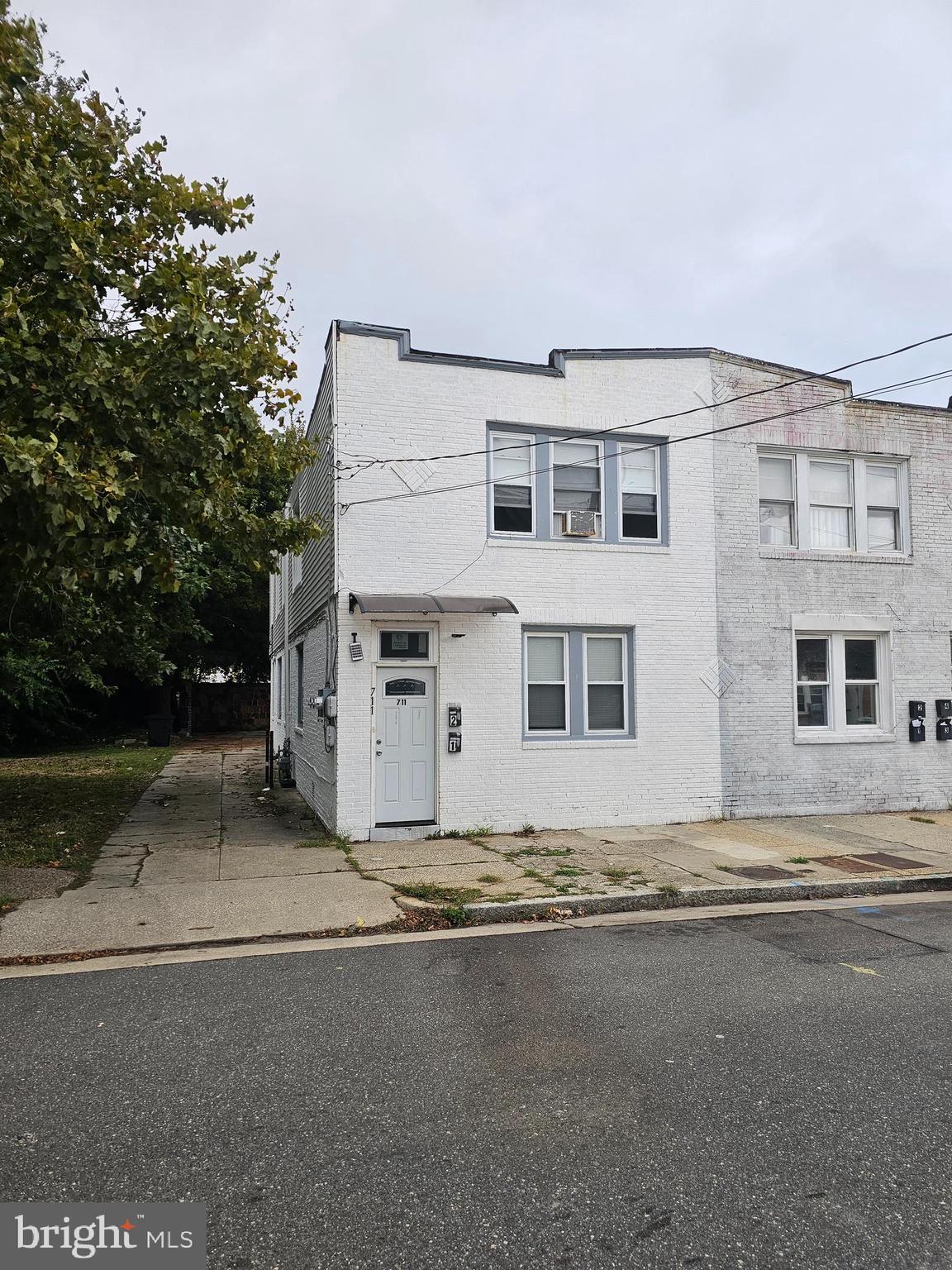 a view of a house with a street