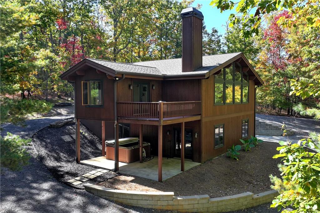 a backyard of a house with table and chairs