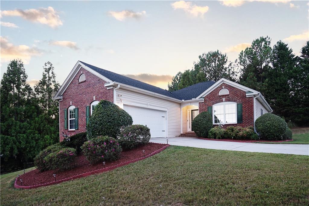 a front view of a house with a yard