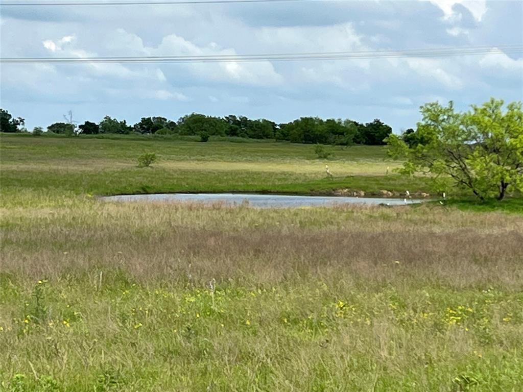 a view of a lake with a building in the background