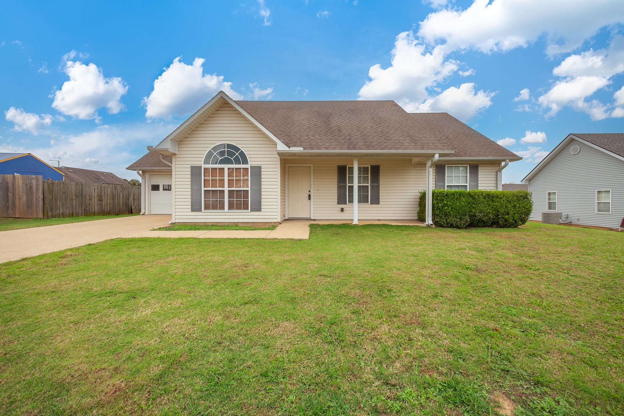 a view of a house with a yard and garage