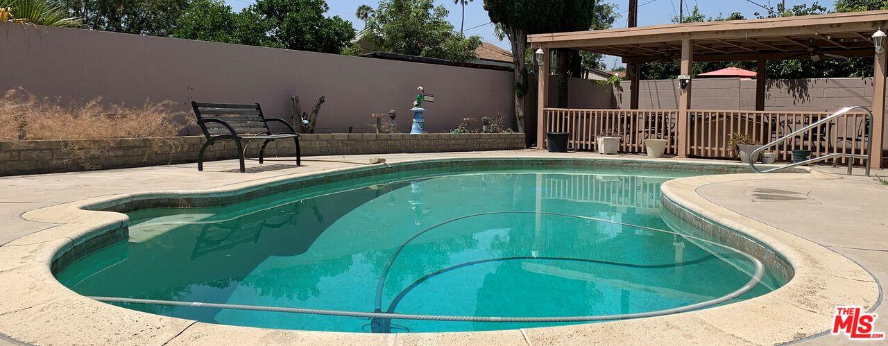 a view of a swimming pool with a patio