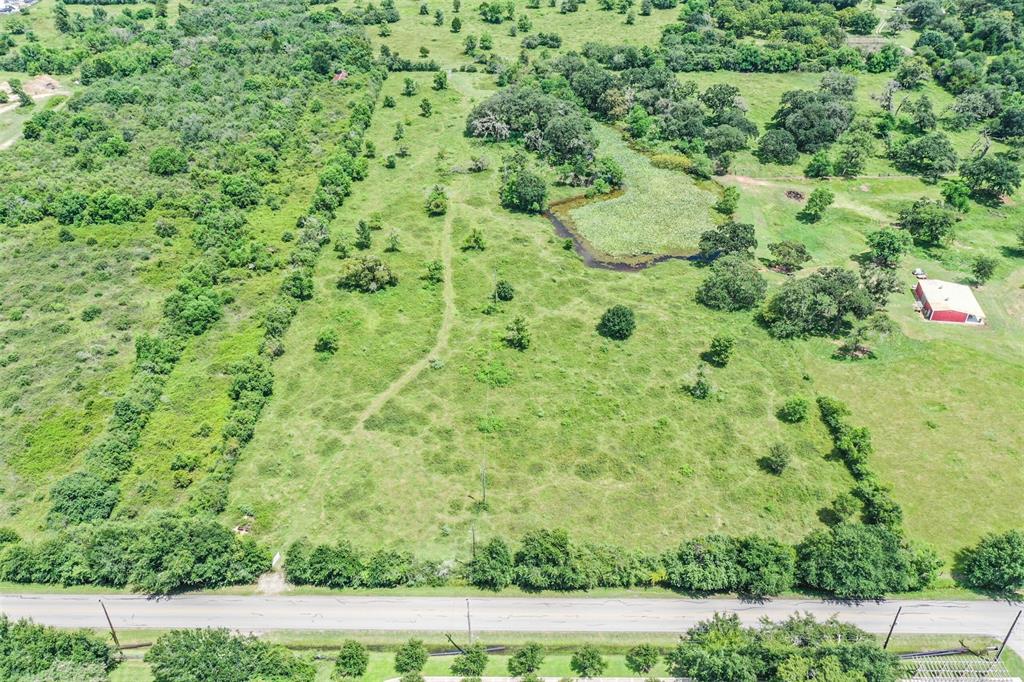 This section of the total 18.828 acres includes a pond (note the red building to the right belongs to a different lot)