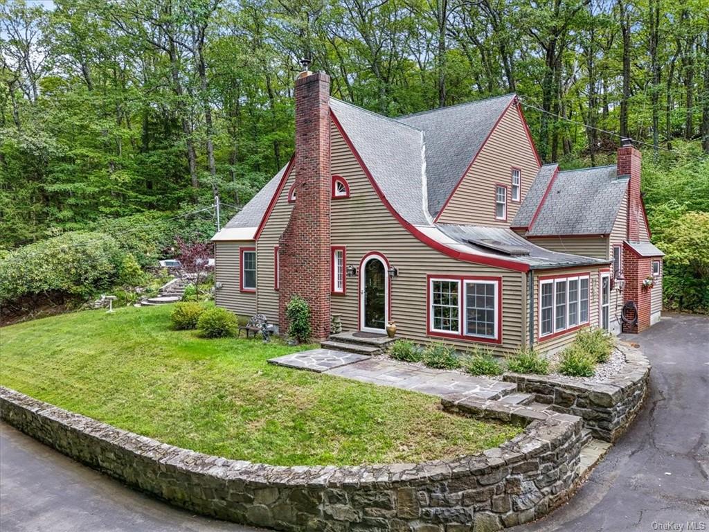 View of front of property with a front lawn