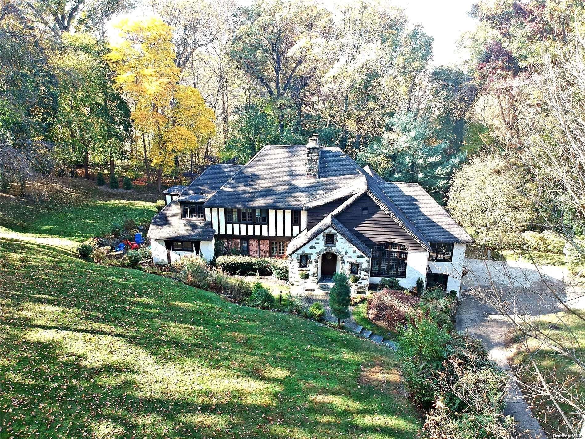 a front view of house with yard and green space