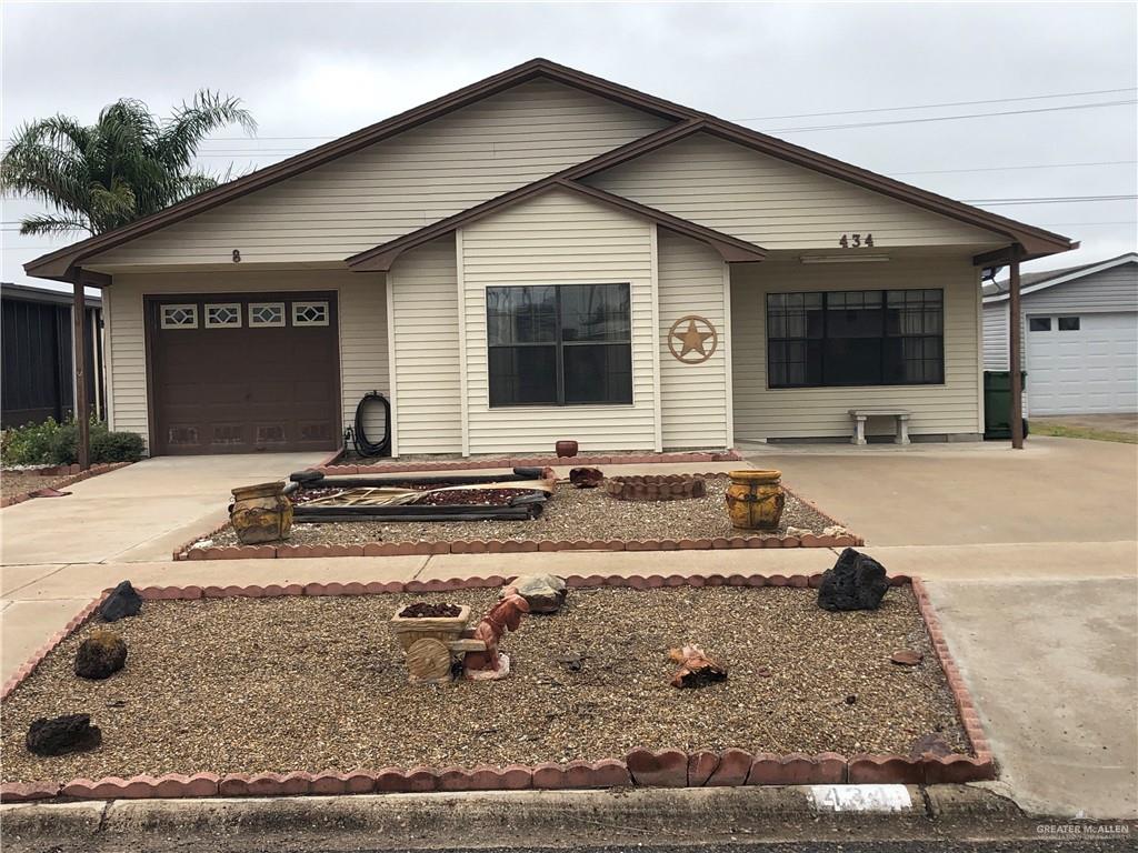 Single story home featuring a garage