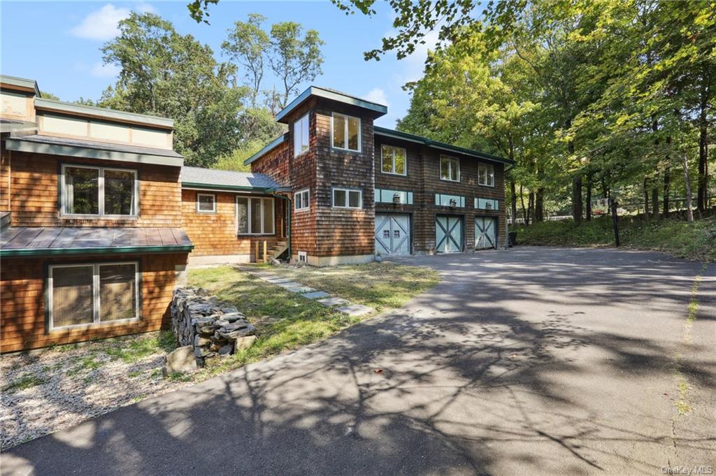 Back of house with a garage