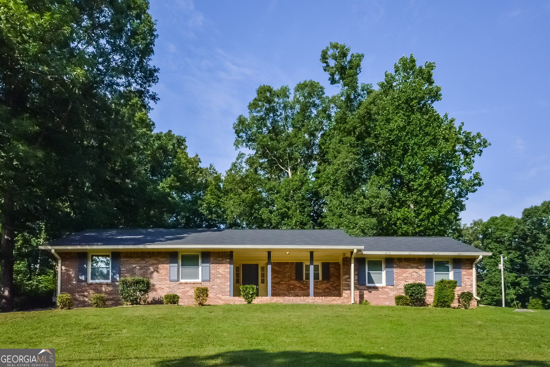 front view of a house with a garden