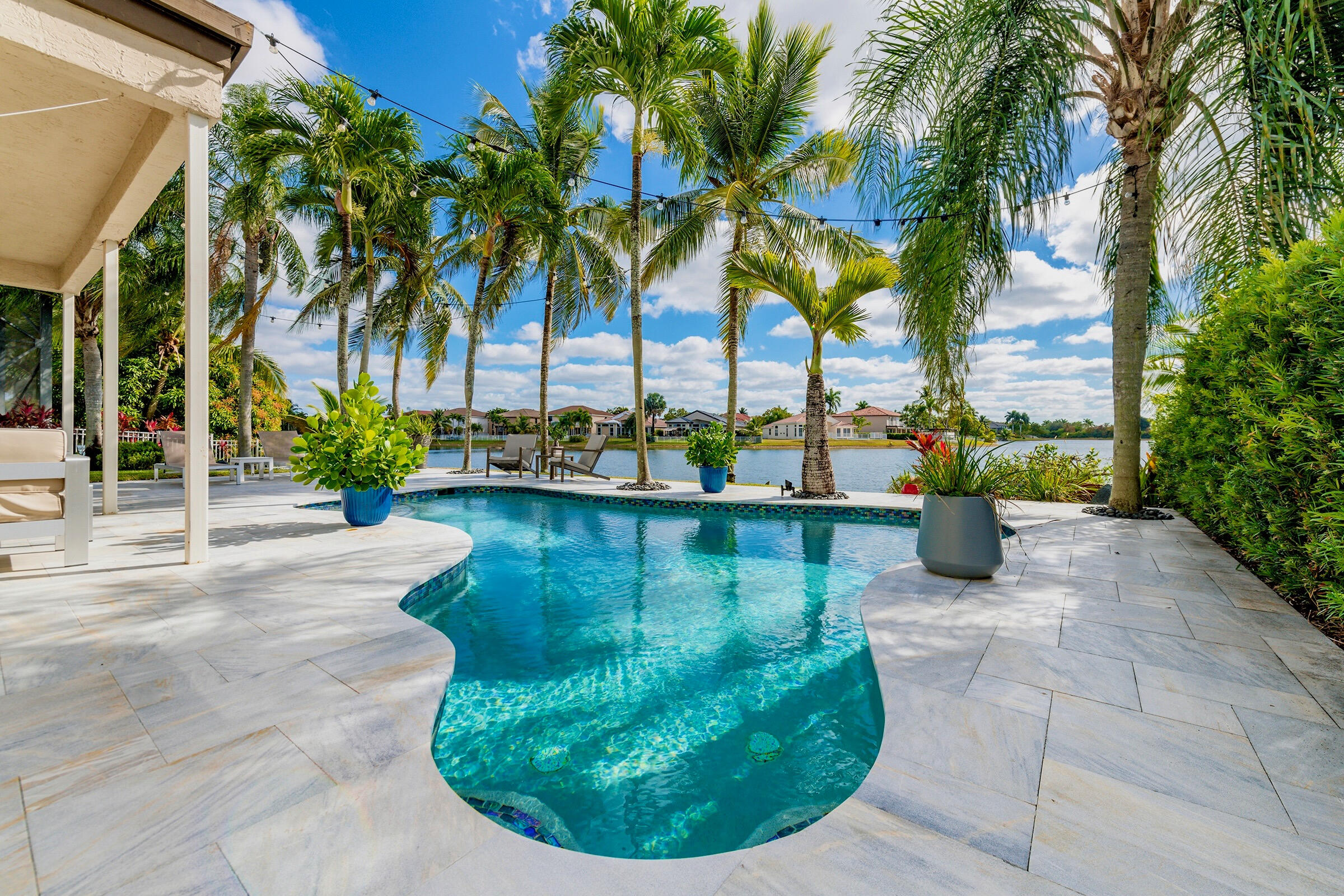 a view of a swimming pool with a yard