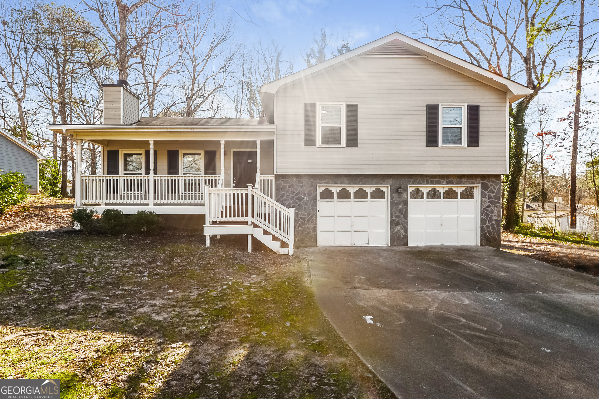 a view of a house with a yard and garage