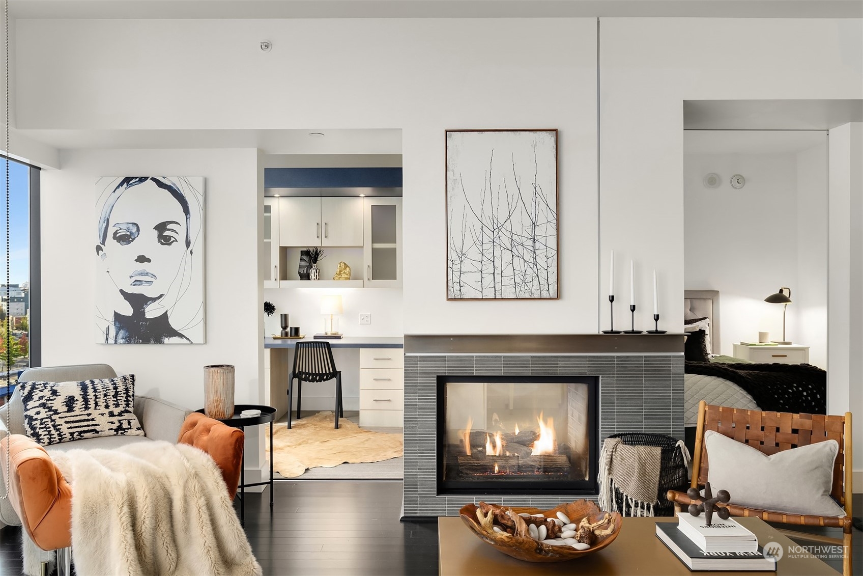 a living room with furniture and a fireplace