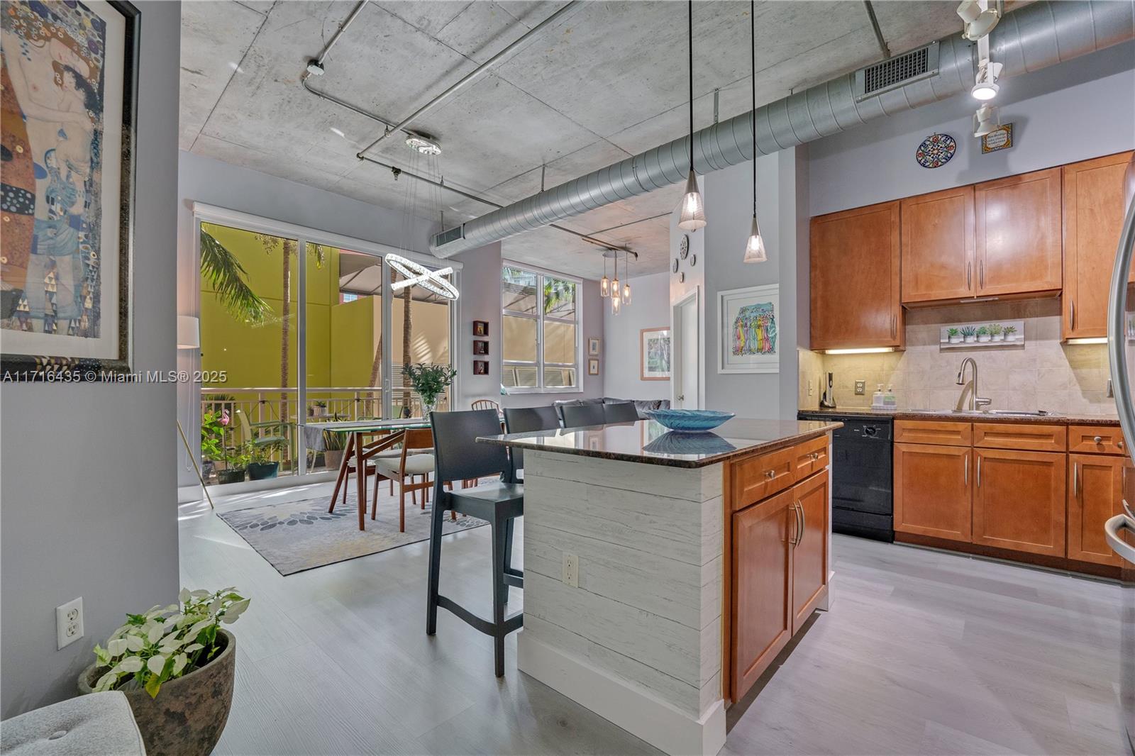 a kitchen with sink cabinets and wooden floor