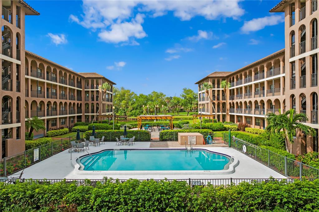 a view of swimming pool with a patio