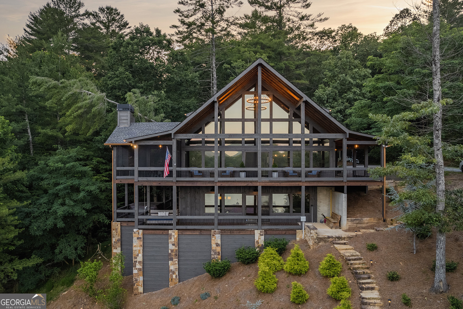 a front view of a house with a yard balcony