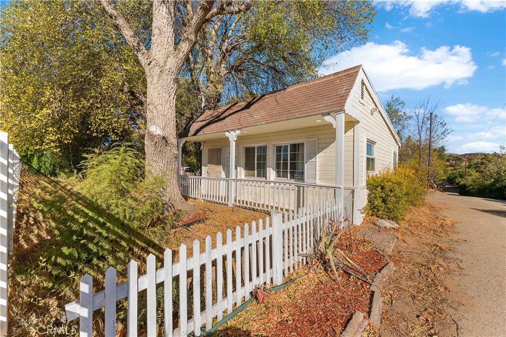 a view of a house with a small yard