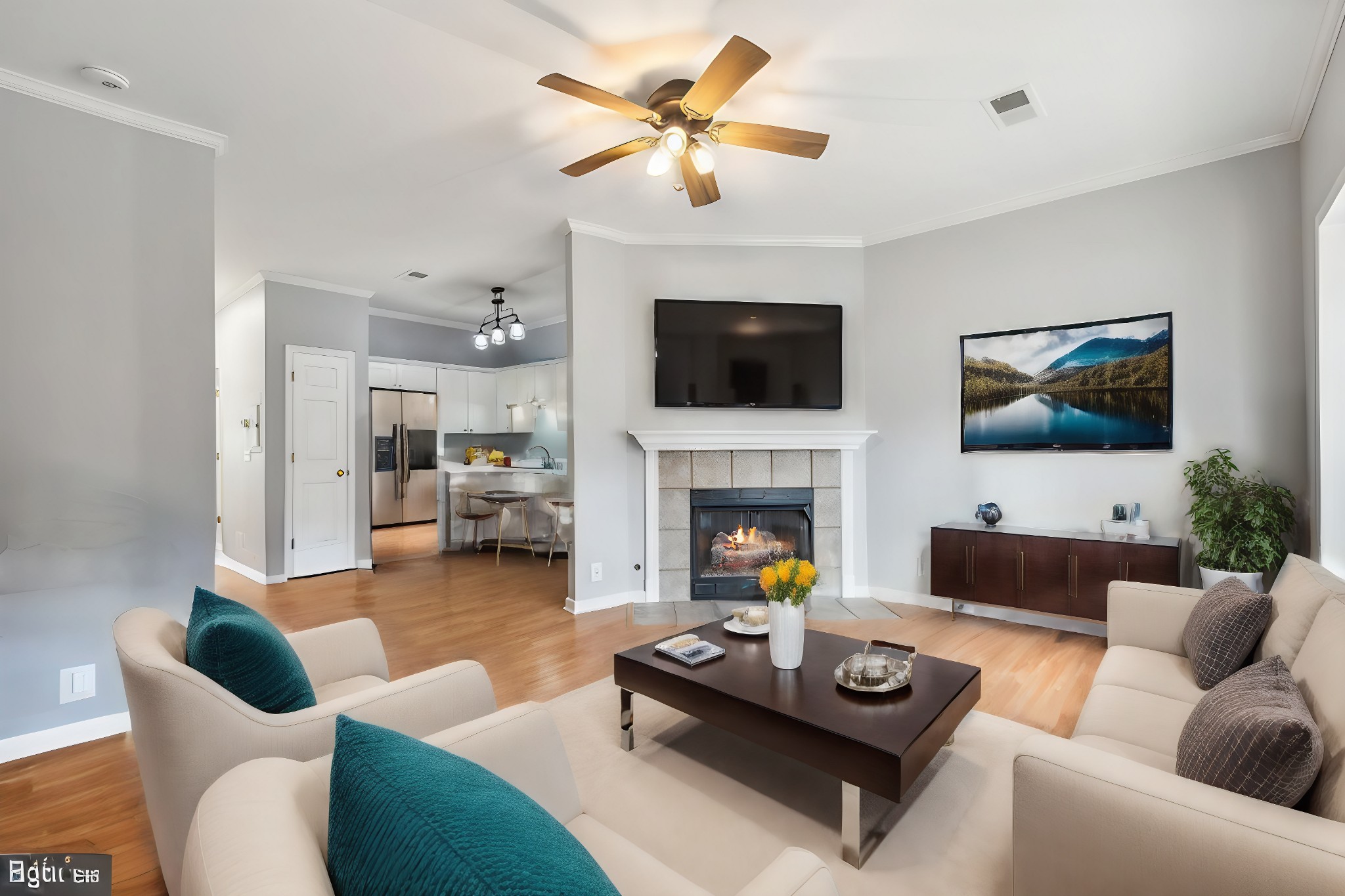 a living room with furniture a flat screen tv and a fireplace