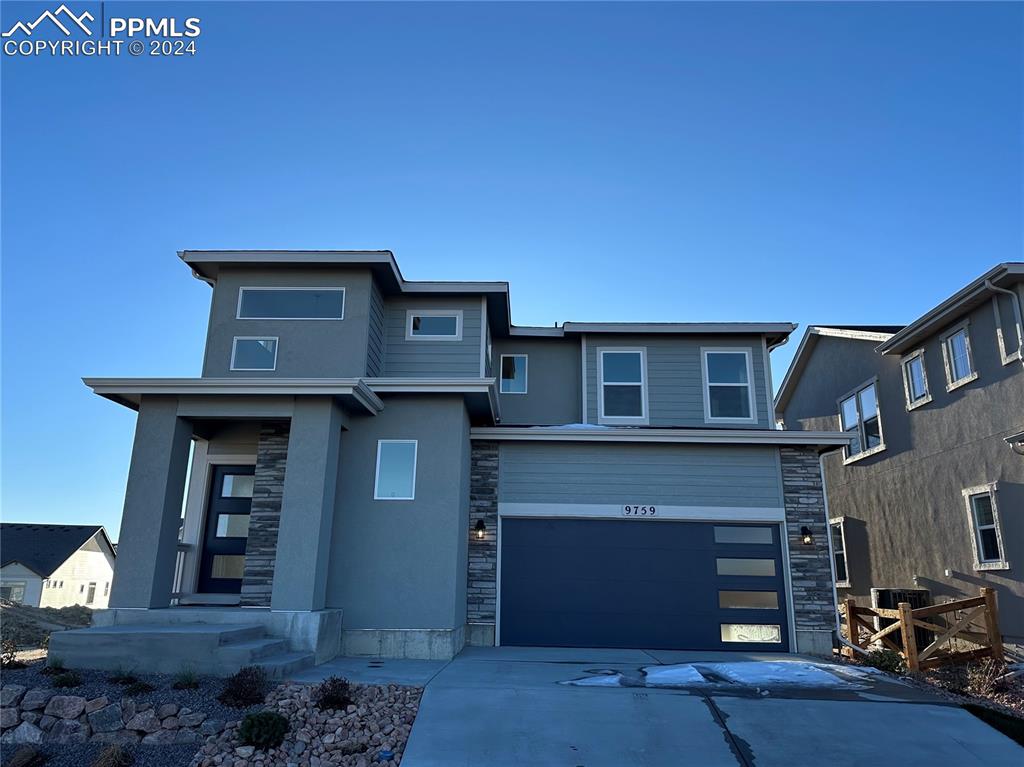 View of front of home with a garage