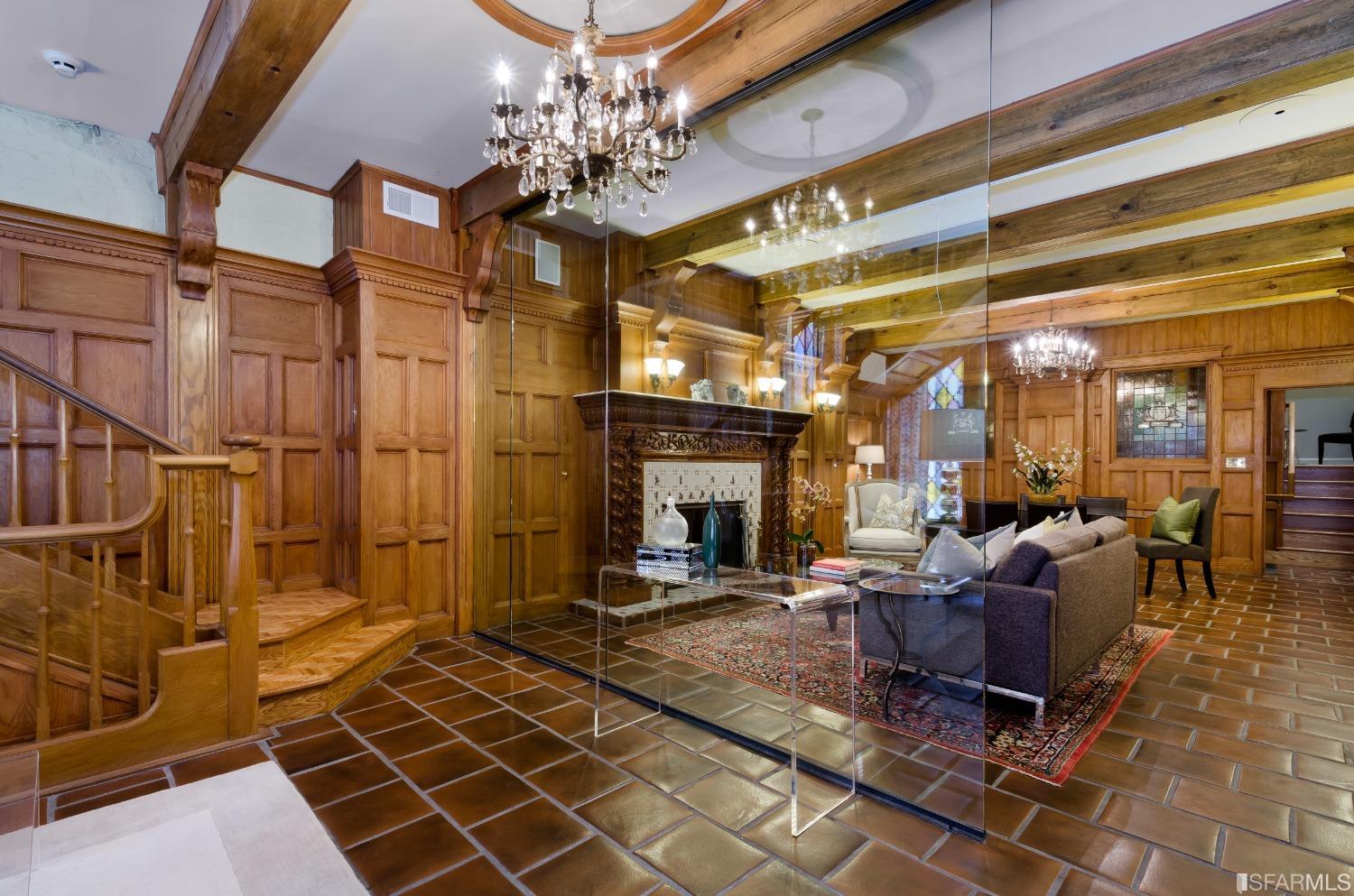 a living room with lots of furniture and a chandelier