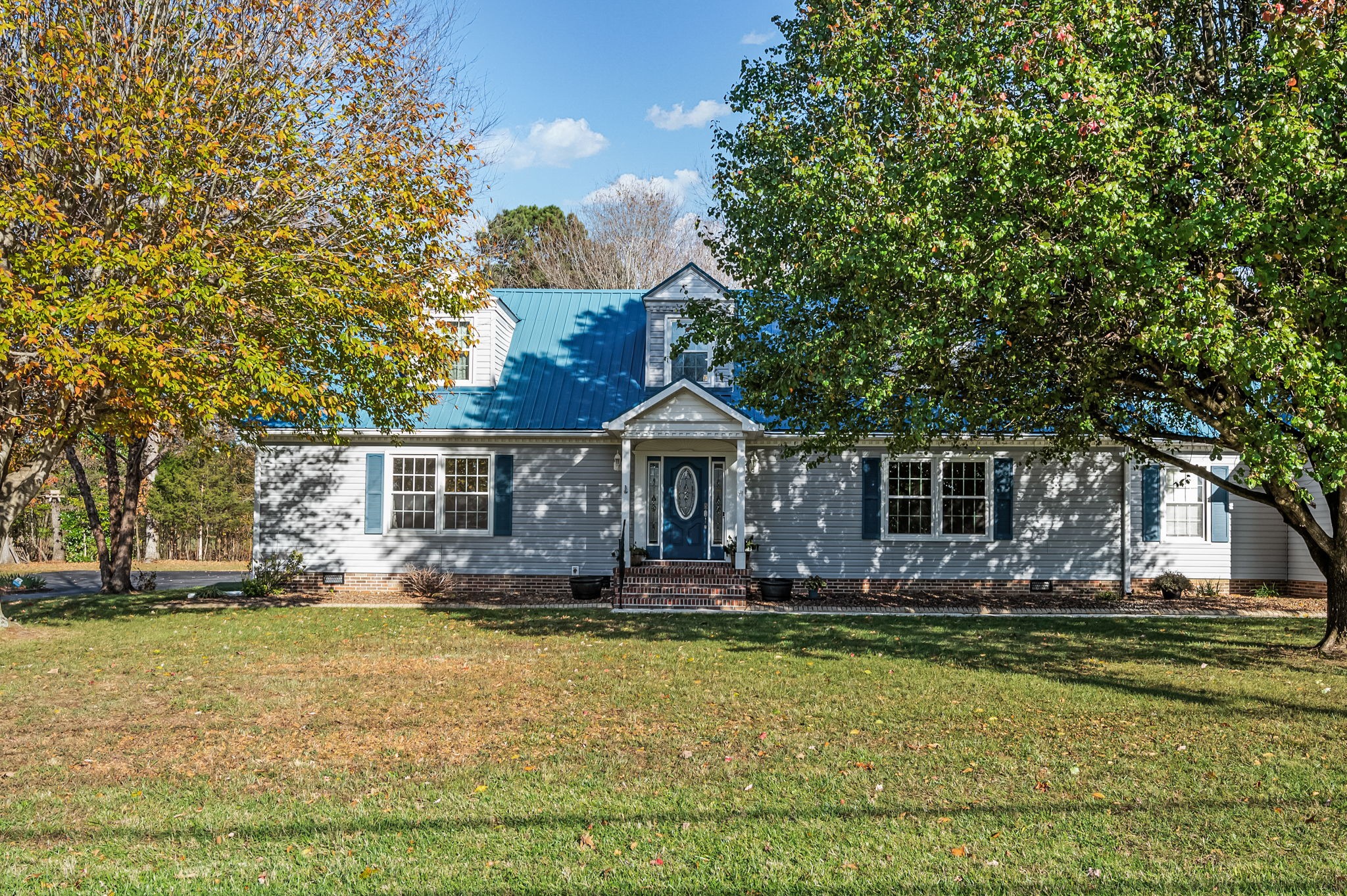 a front view of a house with a yard