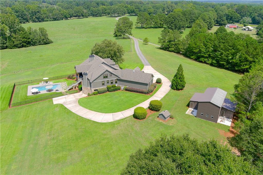 an aerial view of a house having yard