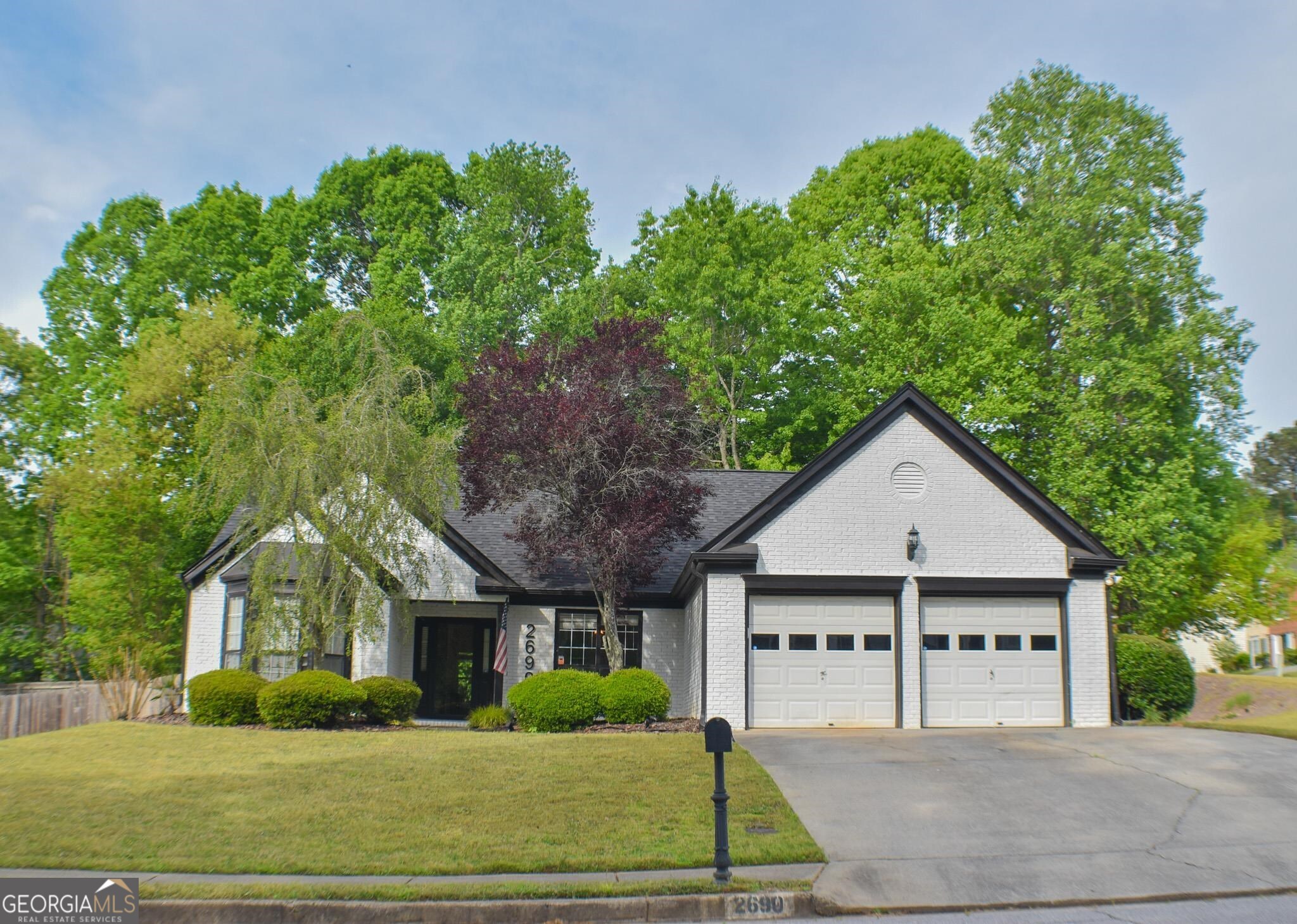 a view of house with a yard