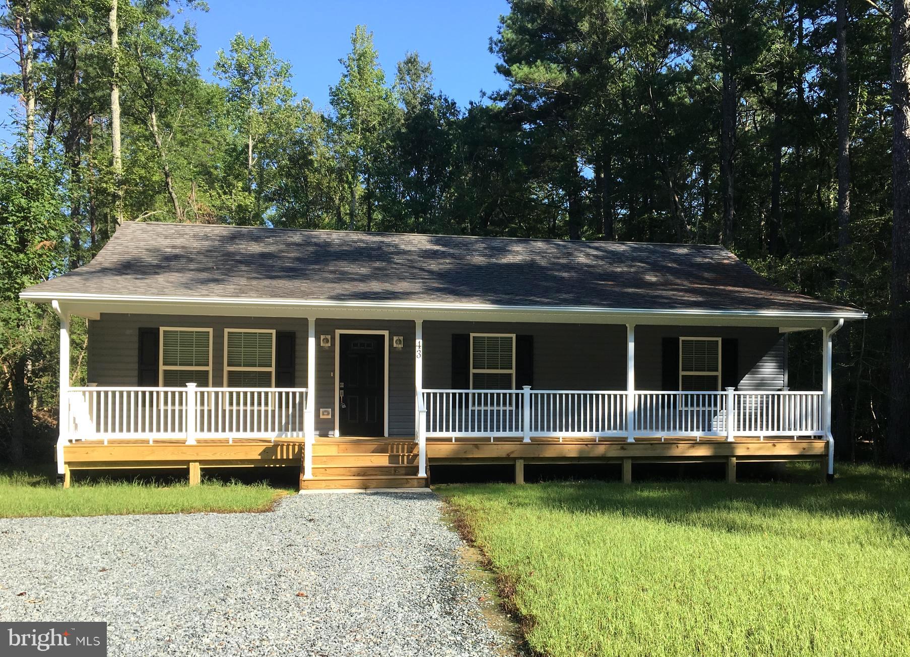 a view of a house with backyard and deck