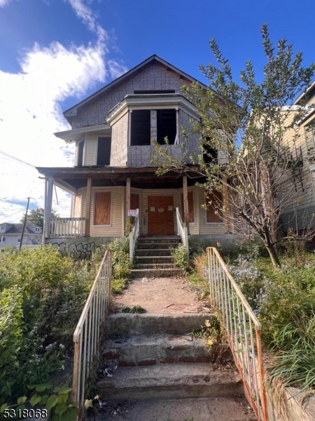 a front view of a house with street