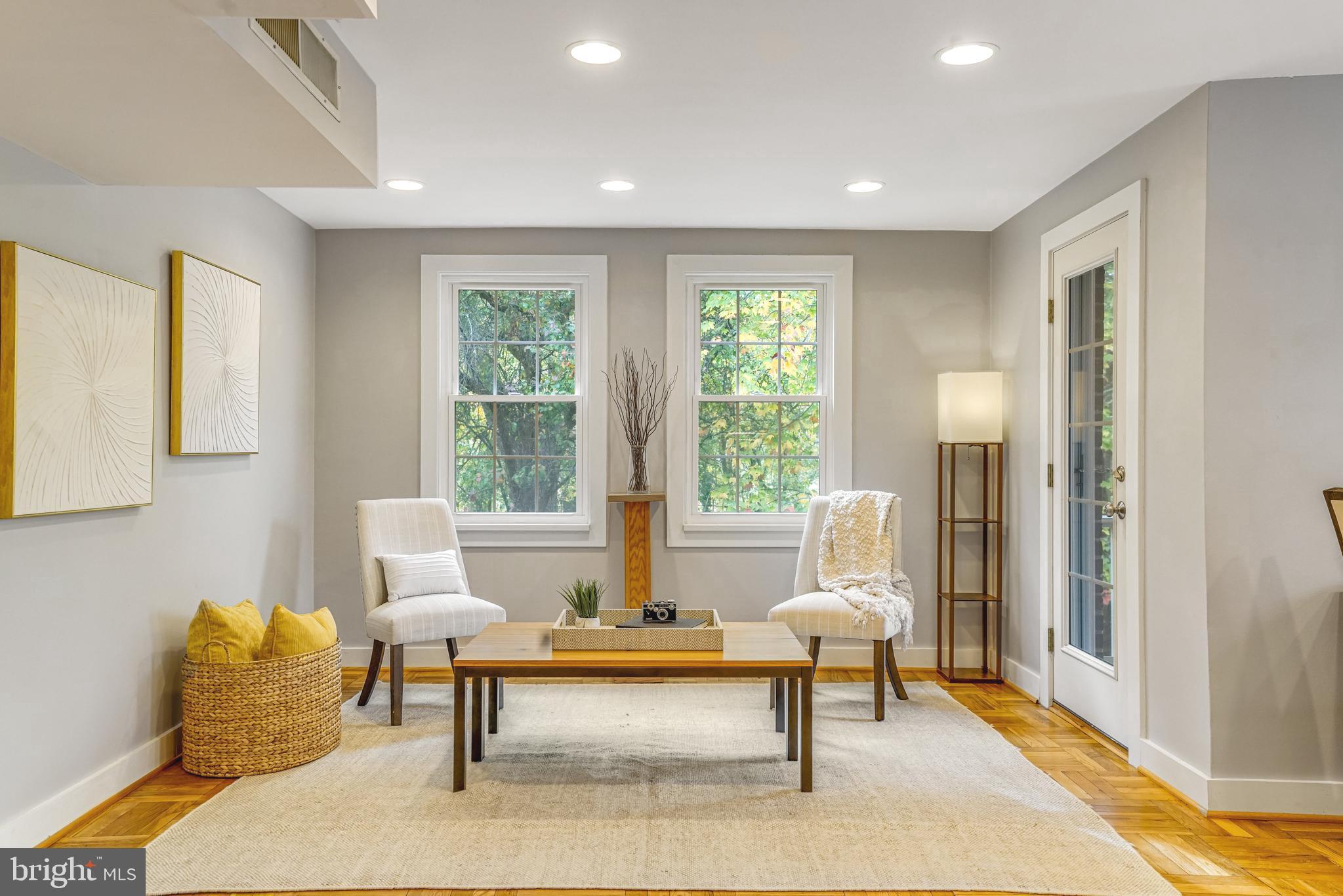 a living room with furniture and a rug