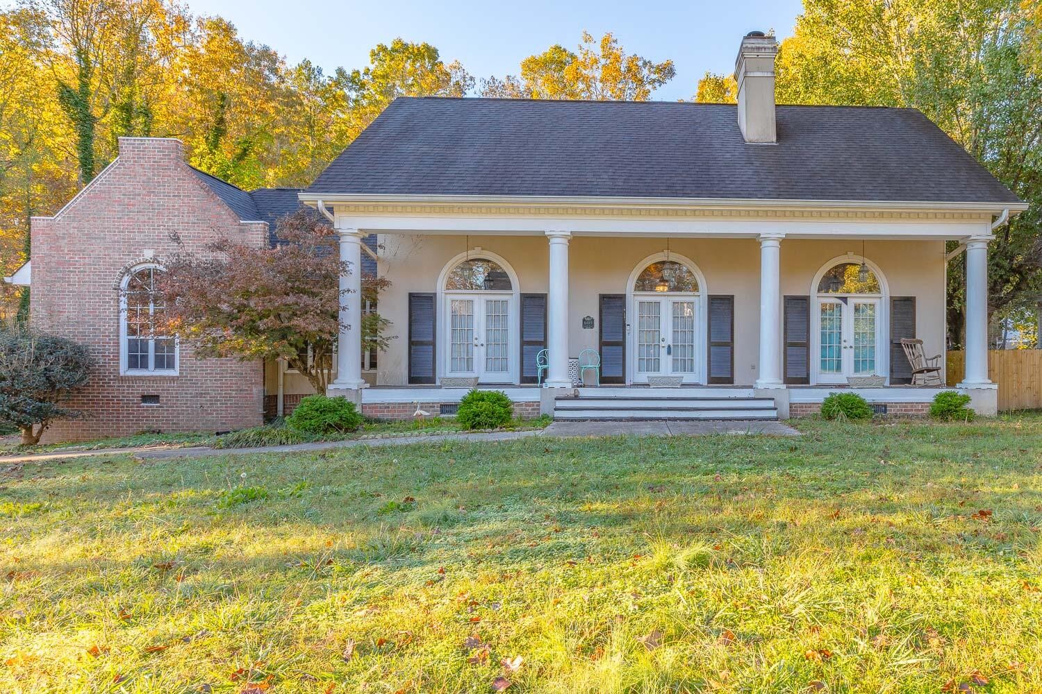 a front view of a house with garden