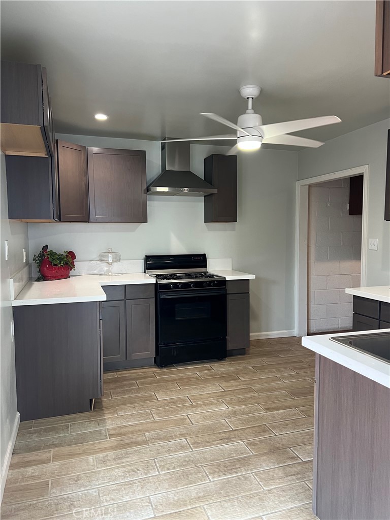 a kitchen with a stove and a refrigerator